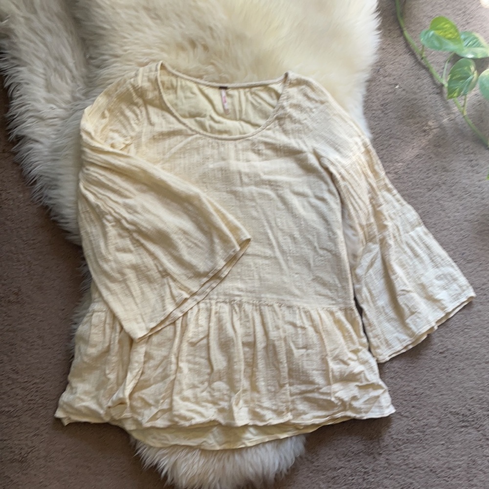 Free People | S pale yellow peplum long trumpet sleeve top with pockets